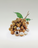 Longan fruit with green leaves on a white background