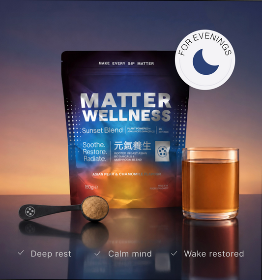 A stand-up pouch of Matter Wellness Sunset Blend sleep supplement displayed on a reflective surface with a glass of amber liquid, a spoonful of powder, and a circular badge reading 'FOR EVENINGS' against a sunset gradient background.